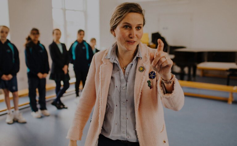 Head of Junior School Emma Gray working with a group of senior school students