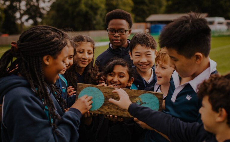 A group of pupils working on a team building challenge at school