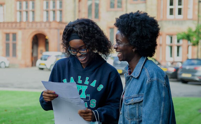 Sixth form student receiving successful A-Level exam results at St Margaret's School Bushey