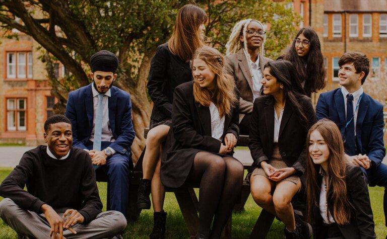 Group of Sixth Form students outside at co-educational school St Margaret's Bushey