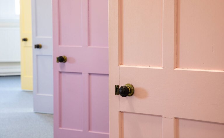 Pretty pastel coloured doors in one of the boarding houses at St Margaret's School