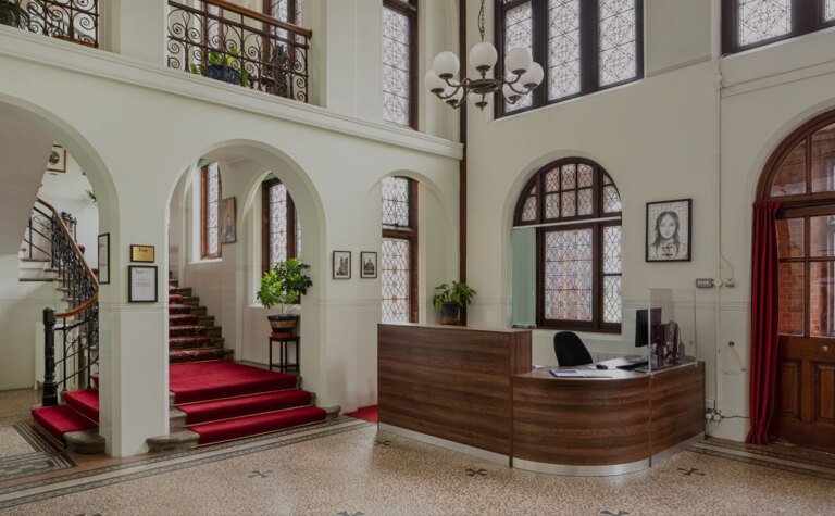 Beautiful desk and stairway in Reception area at St Margaret's School Bushey