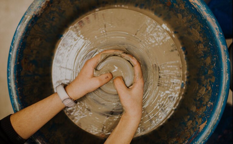 St Margarets School pupil using pottery wheel in art lesson