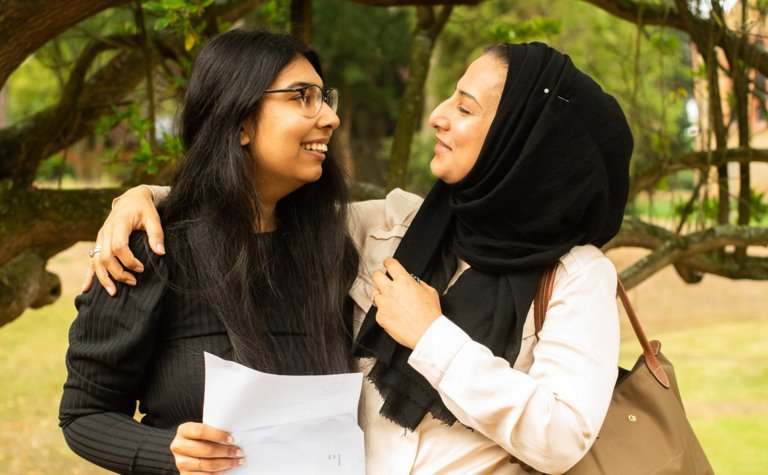 St Margarets School Pupil and mother hugging and smiling after successful exam results