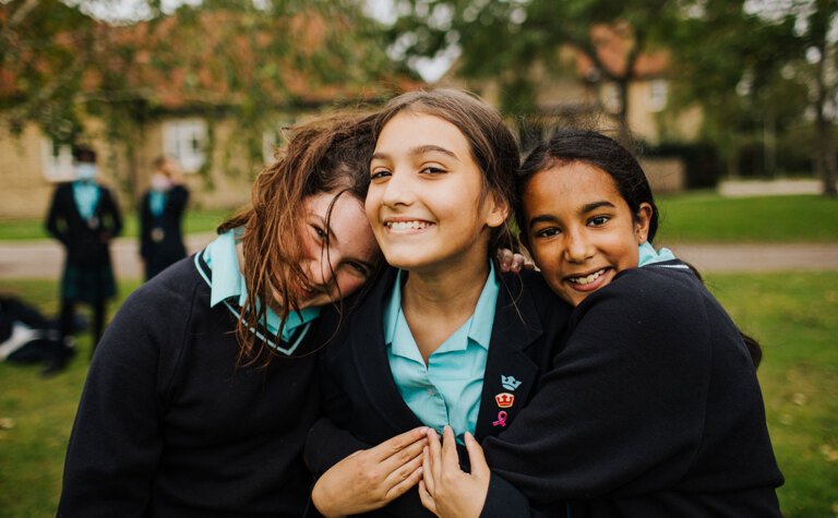 Three happy senior school pupils at St Margaret's independent School Bushey