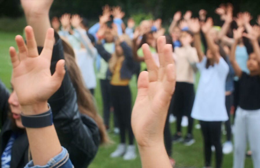 Pupils out on the St Margaret's School grounds starring in a music video