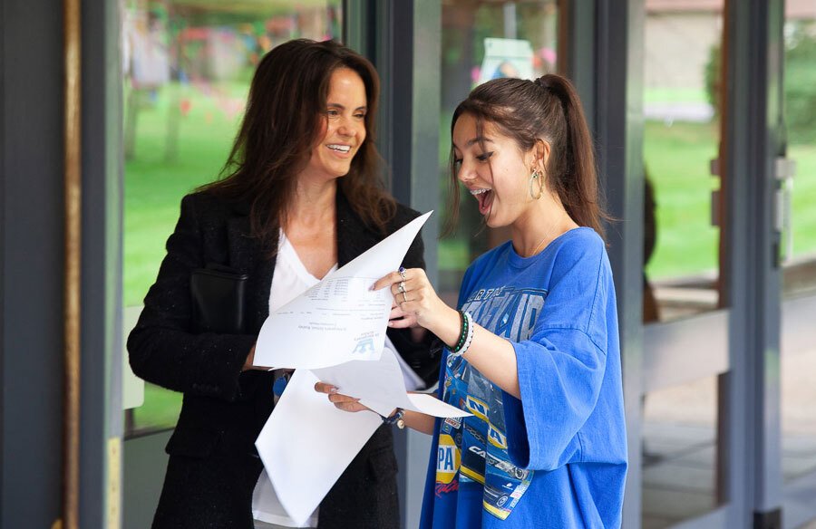 Mother and St Margaret's School pupil opening GCSE results 2021