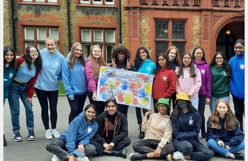 St Margaret's Sixth Form Students outside front of Waterhouse in 2021 Leaver's Hoodies