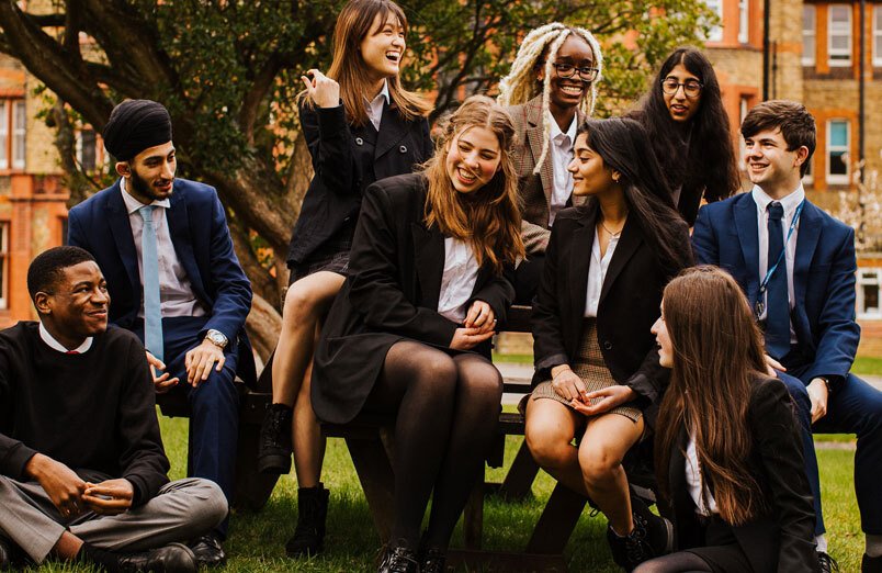 Group of Sixth Form students outside at co-educational school St Margaret's Bushey