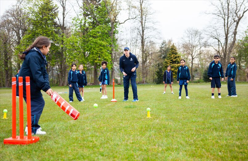 Junior School pupils at St Margarets School playing cricket on field