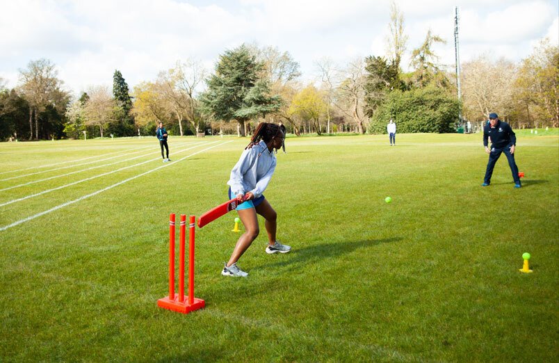 Senior School female pupil at St Margarets School batting during a cricket masterclass delivered by Harrow School