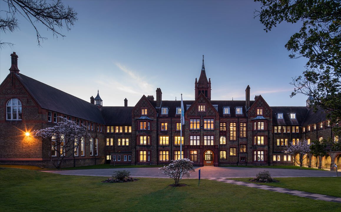 Twilight image of the front of the Waterhouse building at St Margaret's independent day and boarding school in Bushey Hertfordshire
