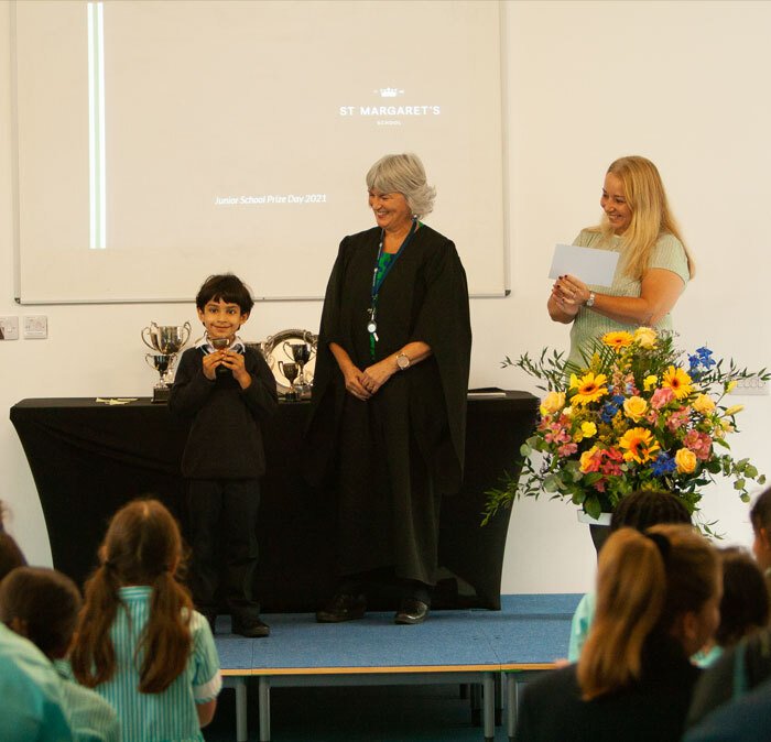 Junior School Prize Winner collecting trophy in September 2021